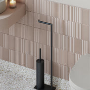 Matte black freestanding toilet paper holder with toilet brush