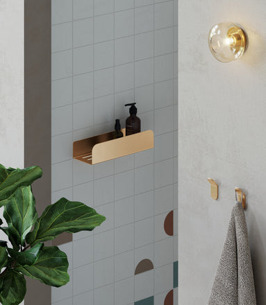 Brushed gold shower shelf