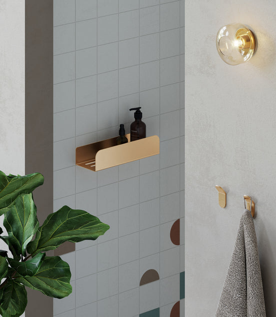 Brushed gold shower shelf